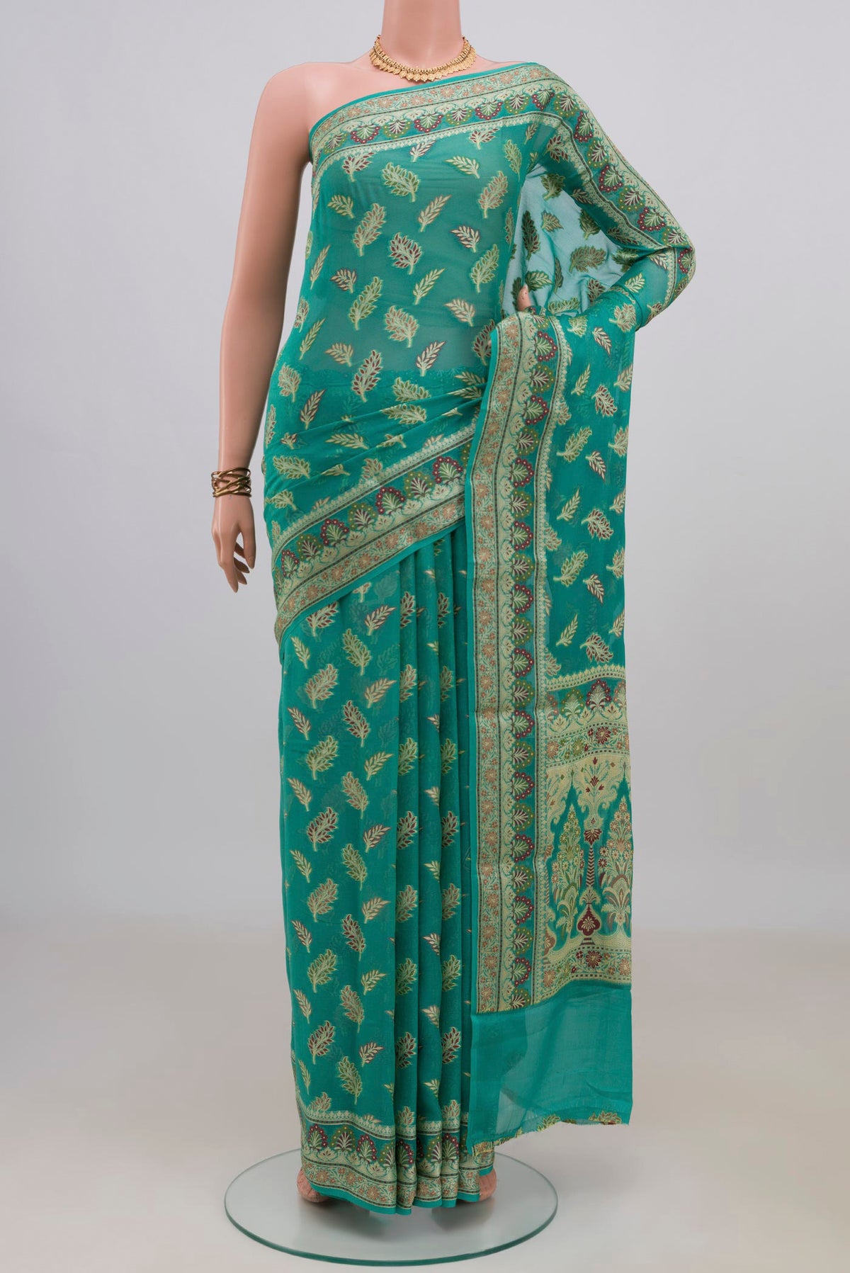 Sea Green Banarasi Georgette Saree with Thread Butta on the body and Fancy Border.  displayed on a mannequin