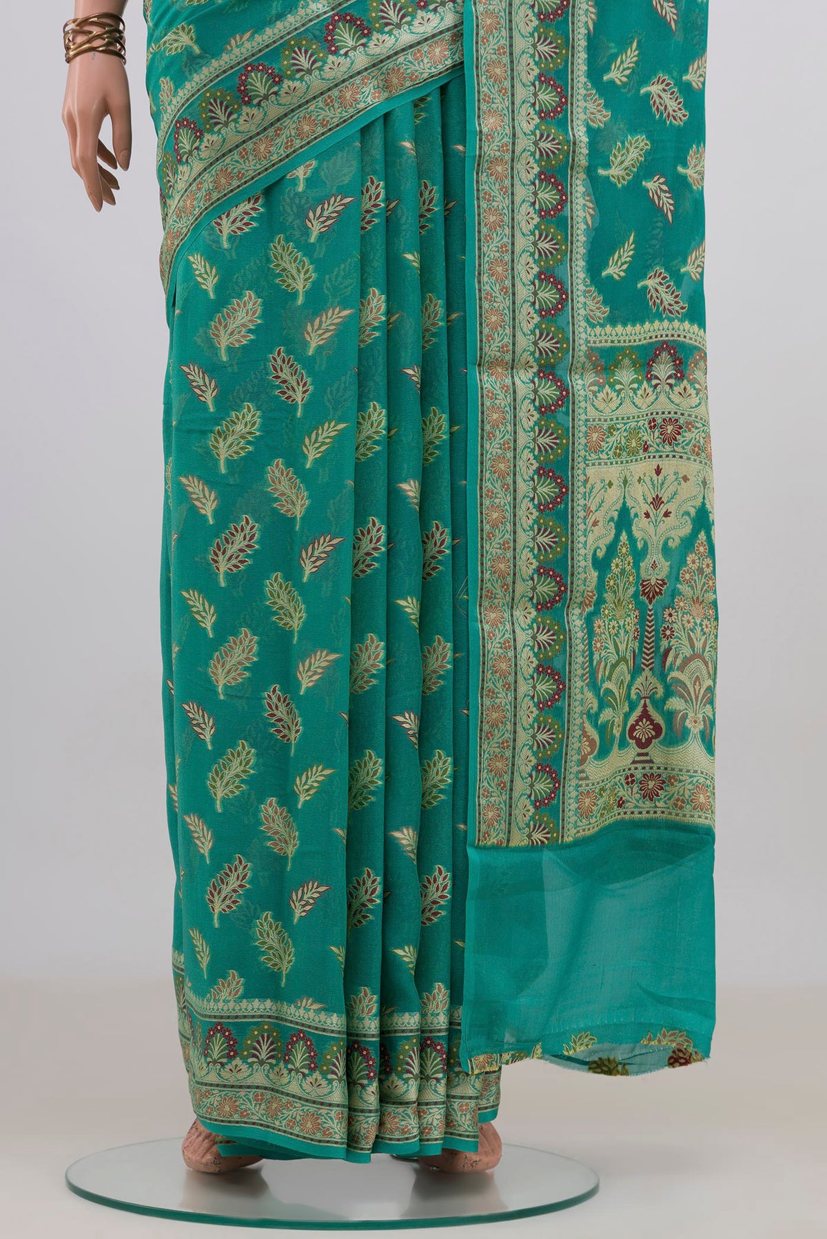 Pleats and pallu of Sea Green Banarasi Georgette Saree with Thread Butta on the body and Fancy Border. 