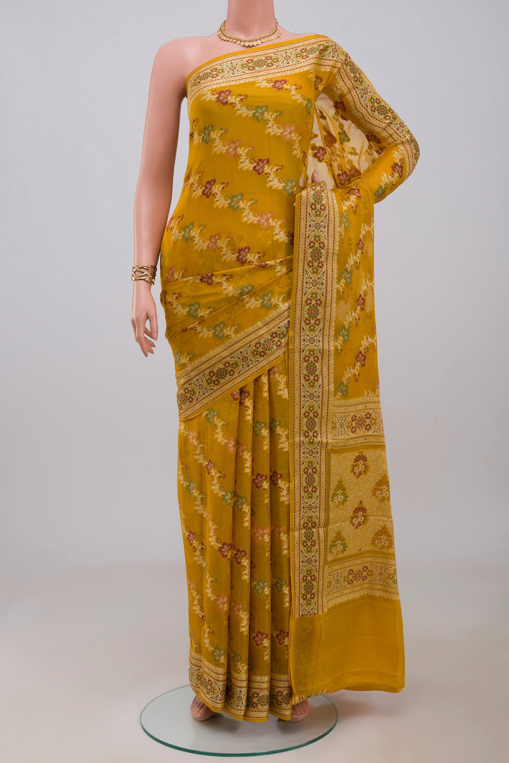 Mustard Banarasi Georgette Saree with Thread Brocade on the body and Thread Border.  displayed on a mannequin