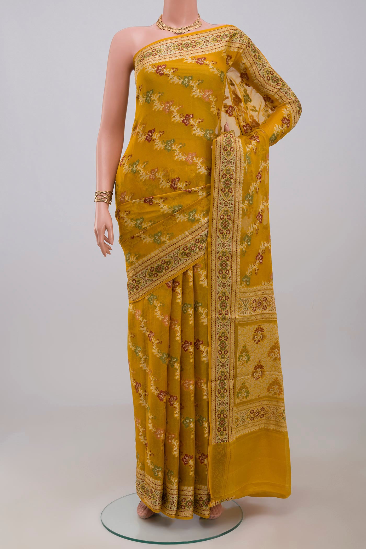 Mustard Banarasi Georgette Saree with Thread Brocade on the body and Thread Border.  displayed on a mannequin