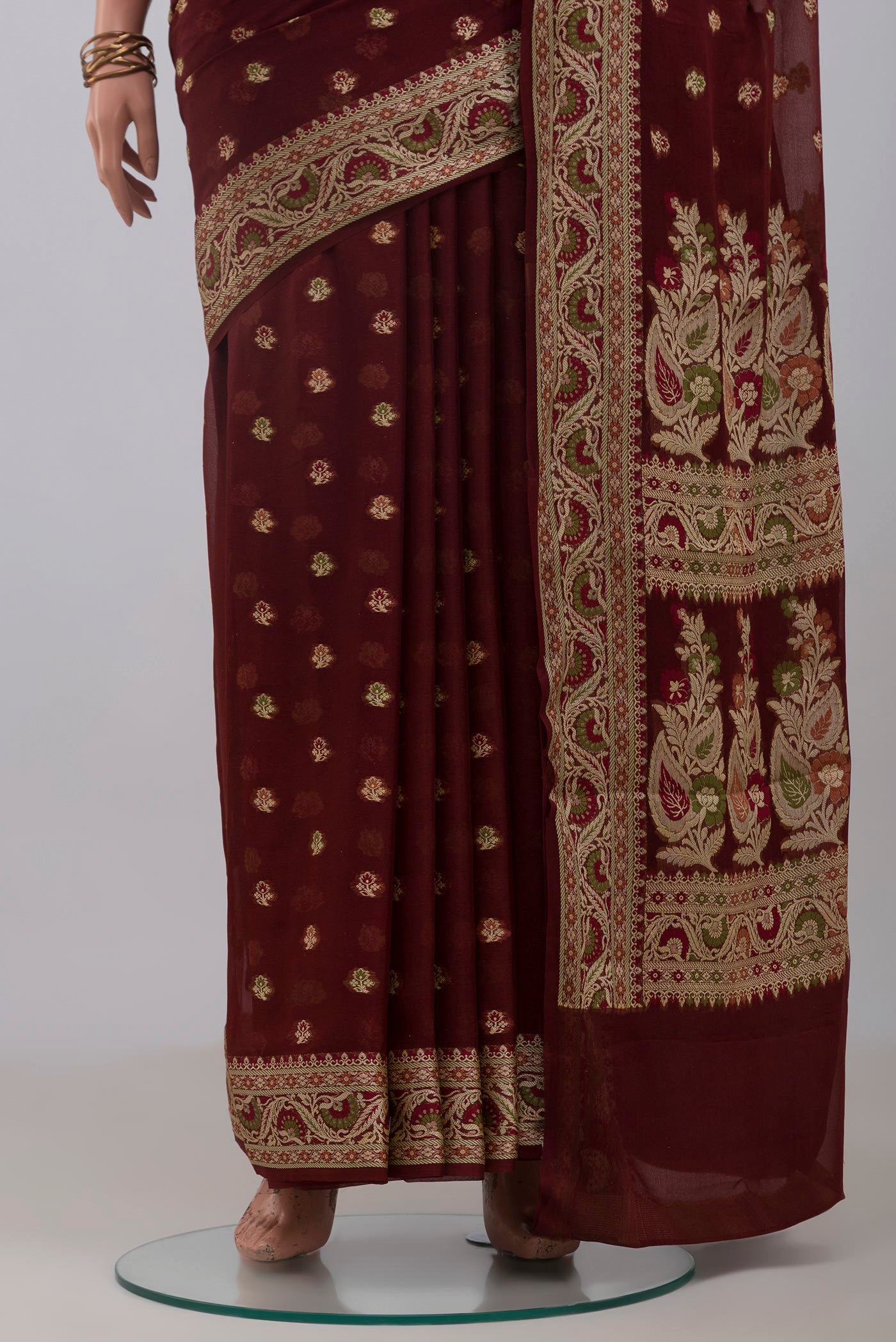 Pleats and pallu of Coffee Brown Banarasi Georgette Saree with Thread Butta on the body and Thread Border. 