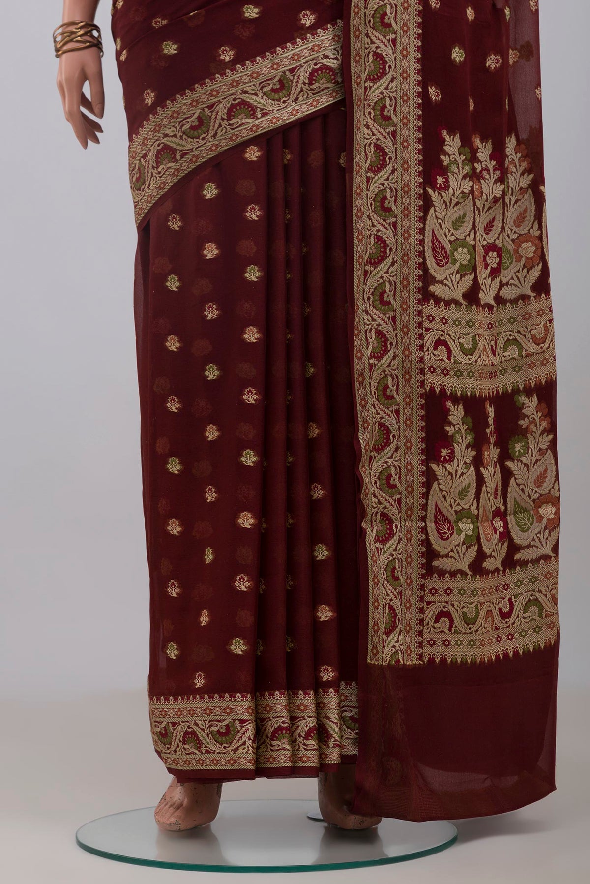 Pleats and pallu of Coffee Brown Banarasi Georgette Saree with Thread Butta on the body and Thread Border. 