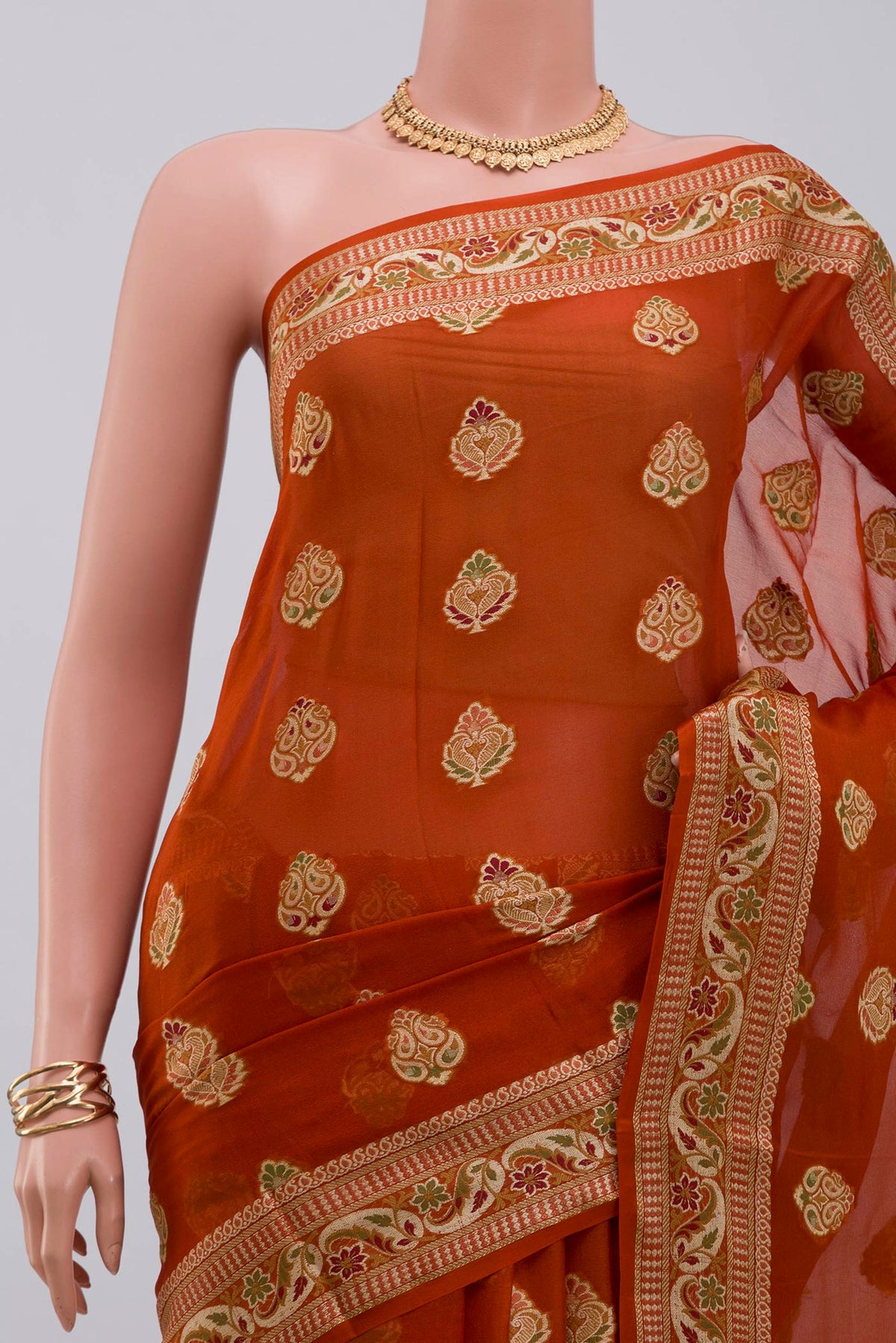 Border image of Rust Georgette Saree with Fancy on the body and Fancy Border. 