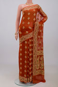 Rust Georgette Saree with Fancy on the body and Fancy Border.  displayed on a mannequin