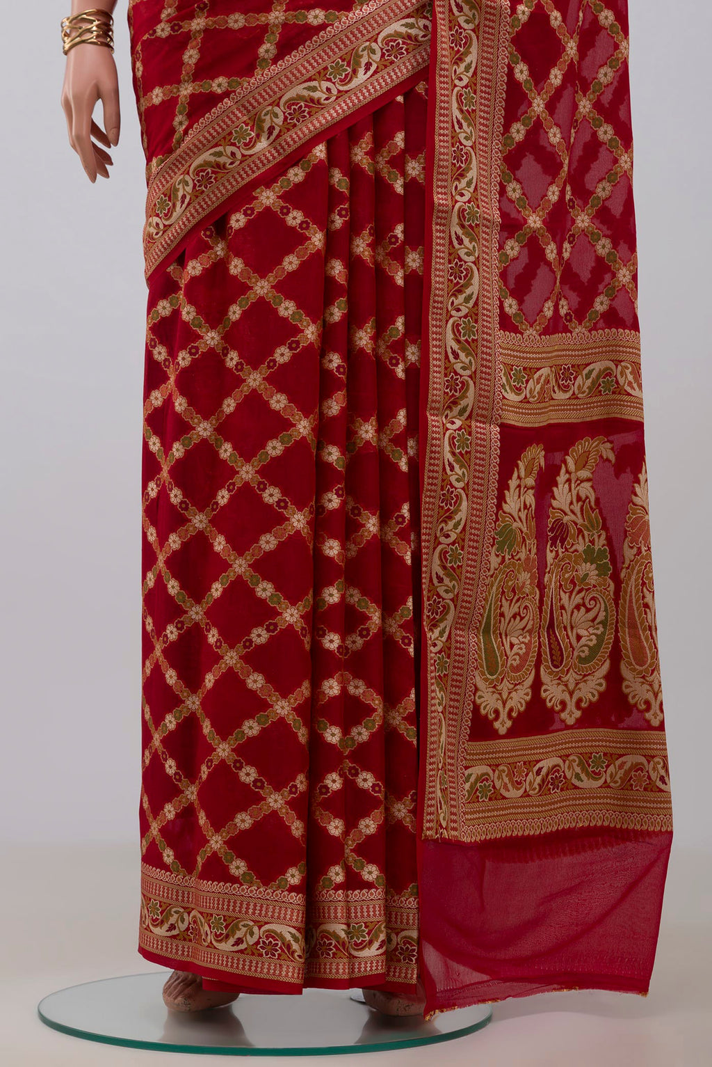 Pleats and pallu of Deep Red Banarasi Georgette Saree with Thread Butta on the body and Zari And Thread Border. 
