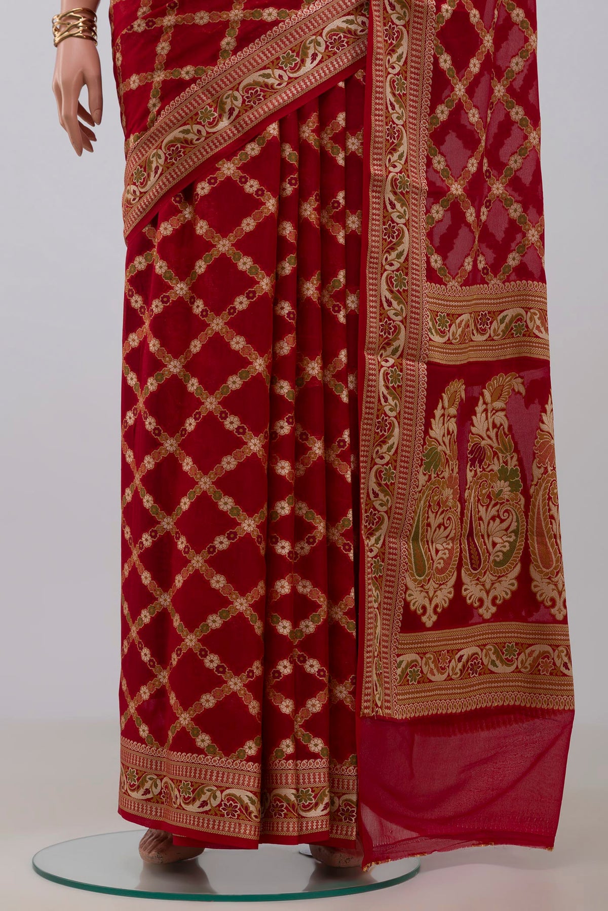 Pleats and pallu of Deep Red Banarasi Georgette Saree with Thread Butta on the body and Zari And Thread Border. 