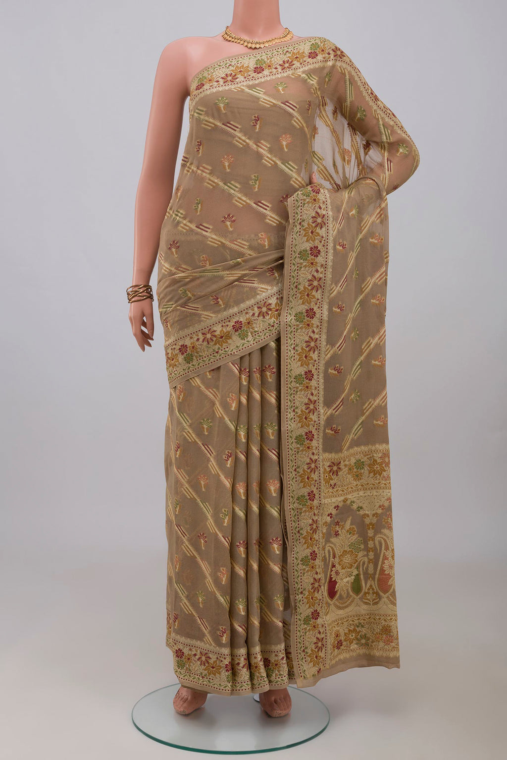 Beige Banarasi Georgette Saree with Thread Butta on the body and Thread Border.  displayed on a mannequin