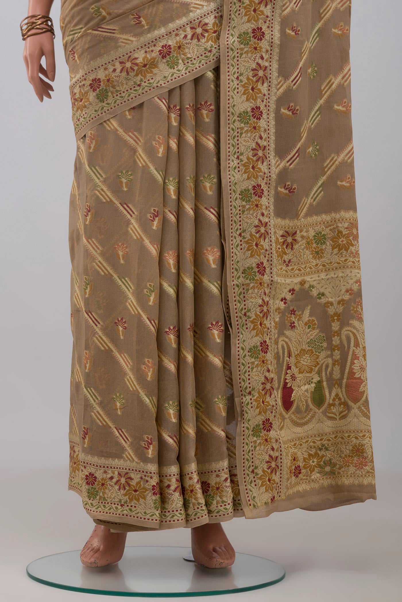 Pleats and pallu of Beige Banarasi Georgette Saree with Thread Butta on the body and Thread Border. 