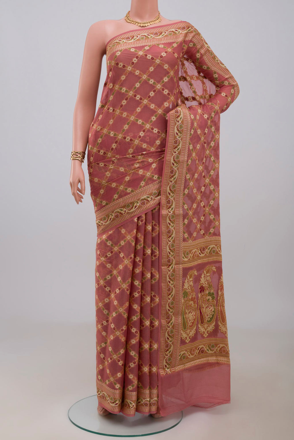 Coral Banarasi Georgette Saree with Thread Butta on the body and Thread Border.  displayed on a mannequin