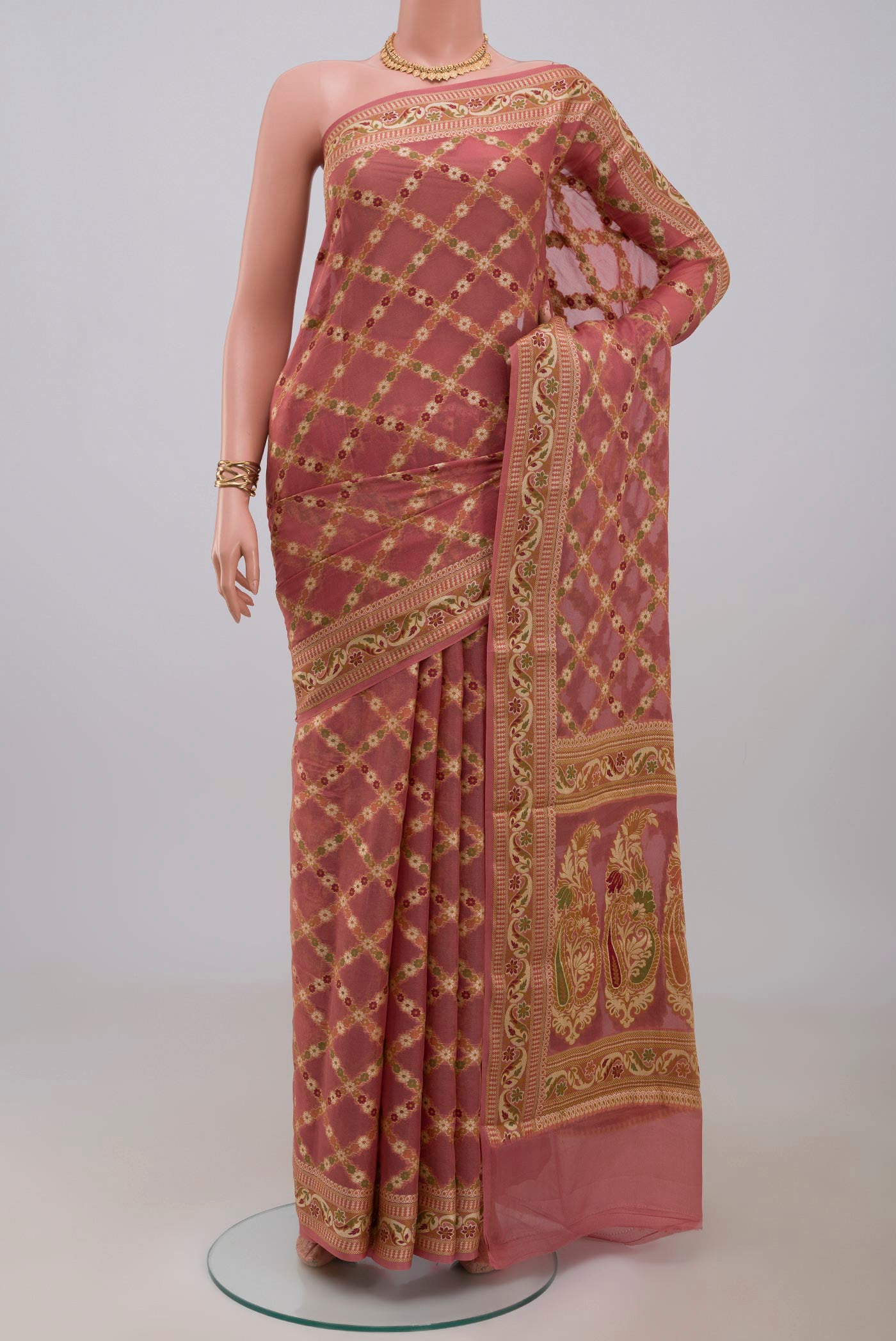 Coral Banarasi Georgette Saree with Thread Butta on the body and Thread Border.  displayed on a mannequin