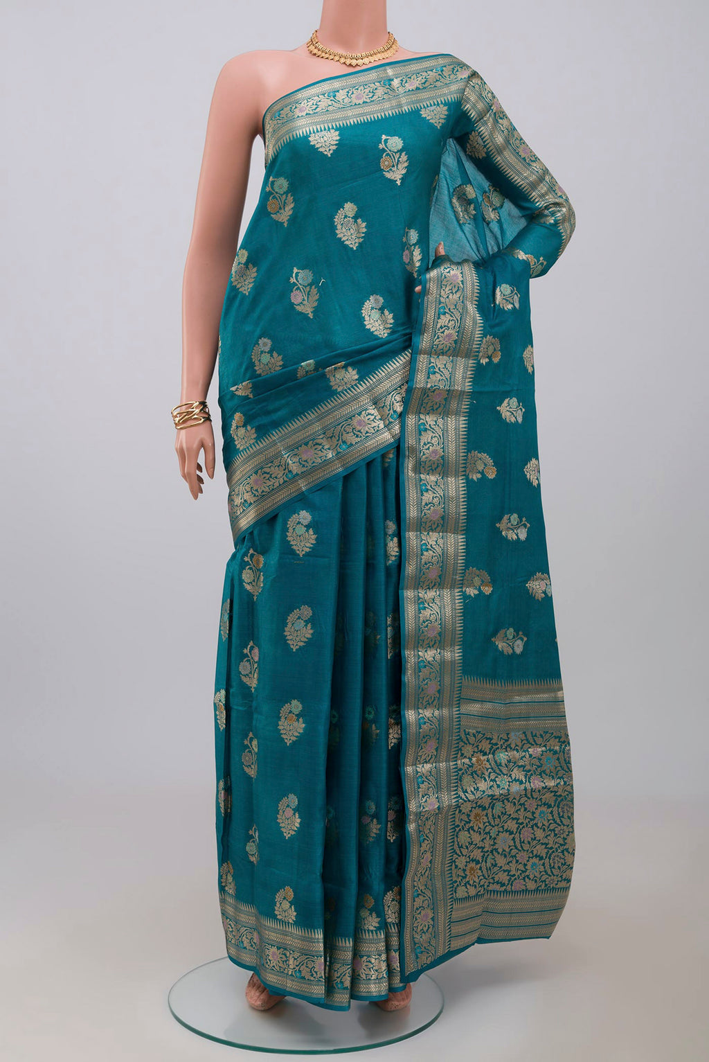 Blue Tussar Silk Saree with Zari Butta on the body and Zari Border.  displayed on a mannequin
