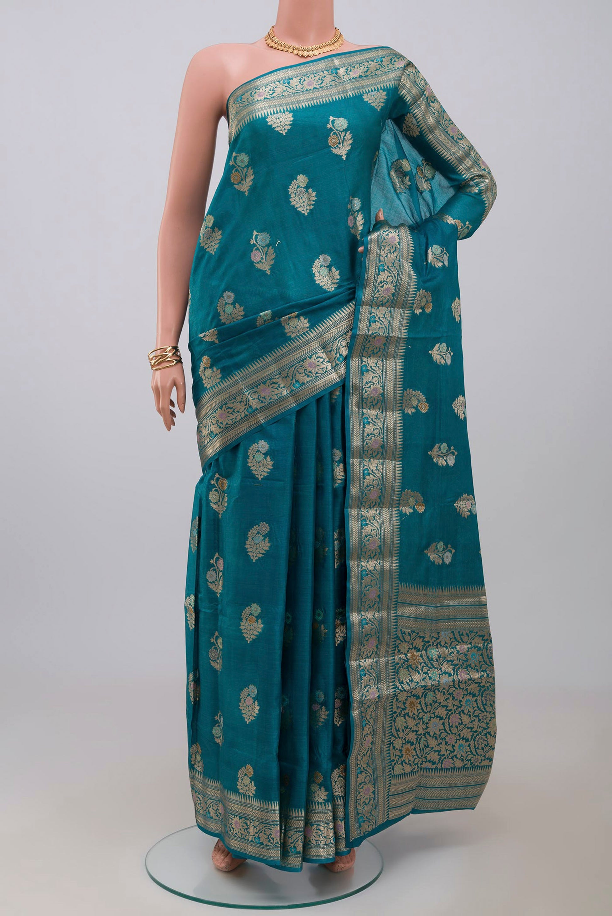 Blue Tussar Silk Saree with Zari Butta on the body and Zari Border.  displayed on a mannequin