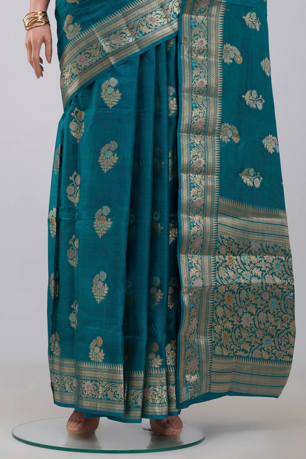 Pleats and pallu of Blue Tussar Silk Saree with Zari Butta on the body and Zari Border. 