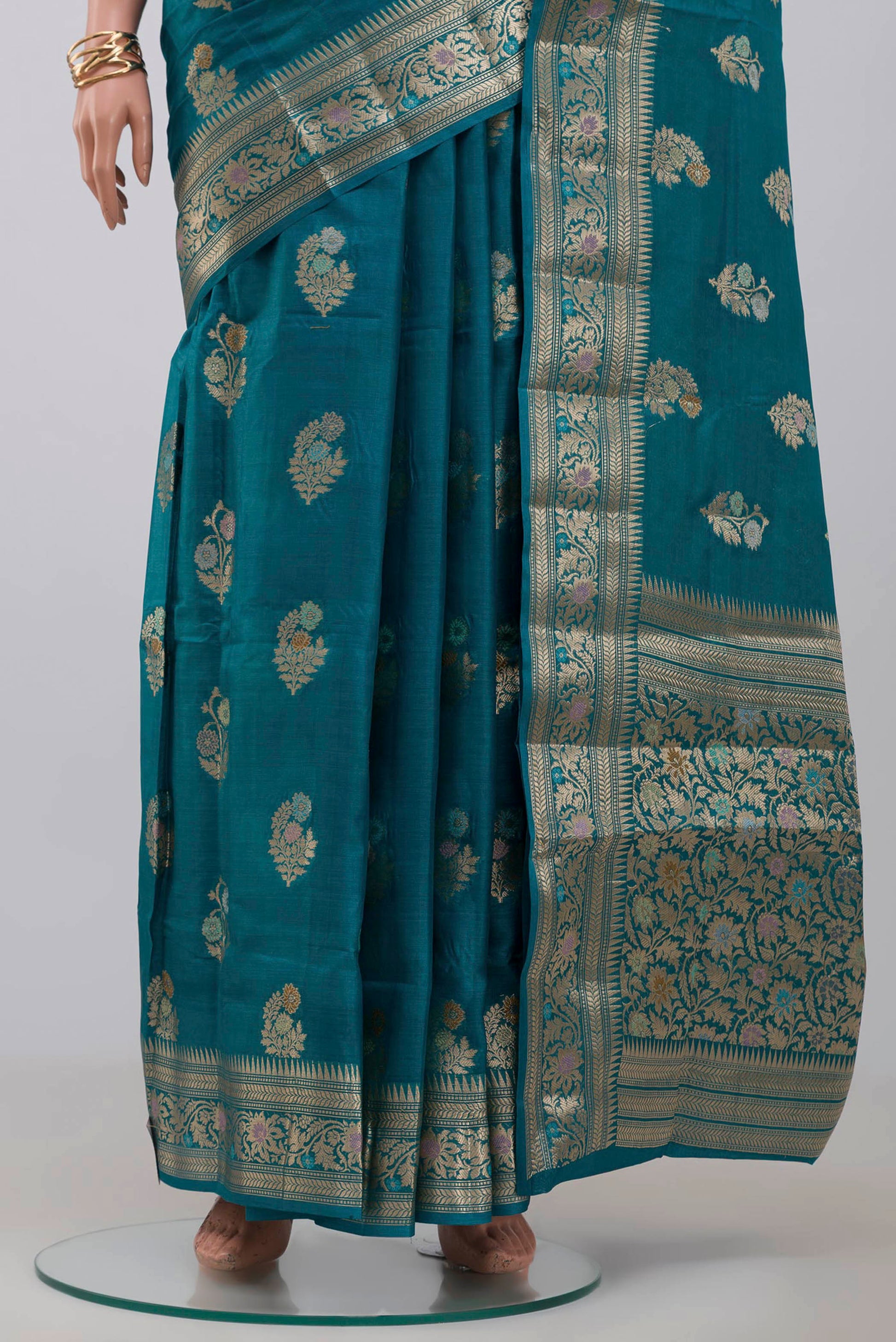Pleats and pallu of Blue Tussar Silk Saree with Zari Butta on the body and Zari Border. 