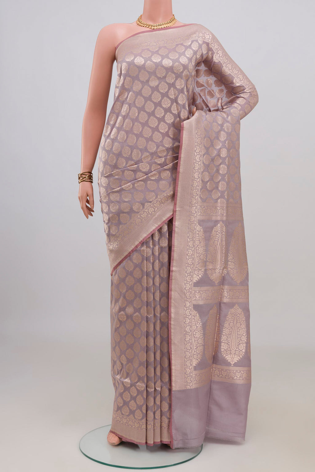 Pure Silk Lavender Banarasi Saree with Zari Brocade on the body and Zari Border.  displayed on a mannequin