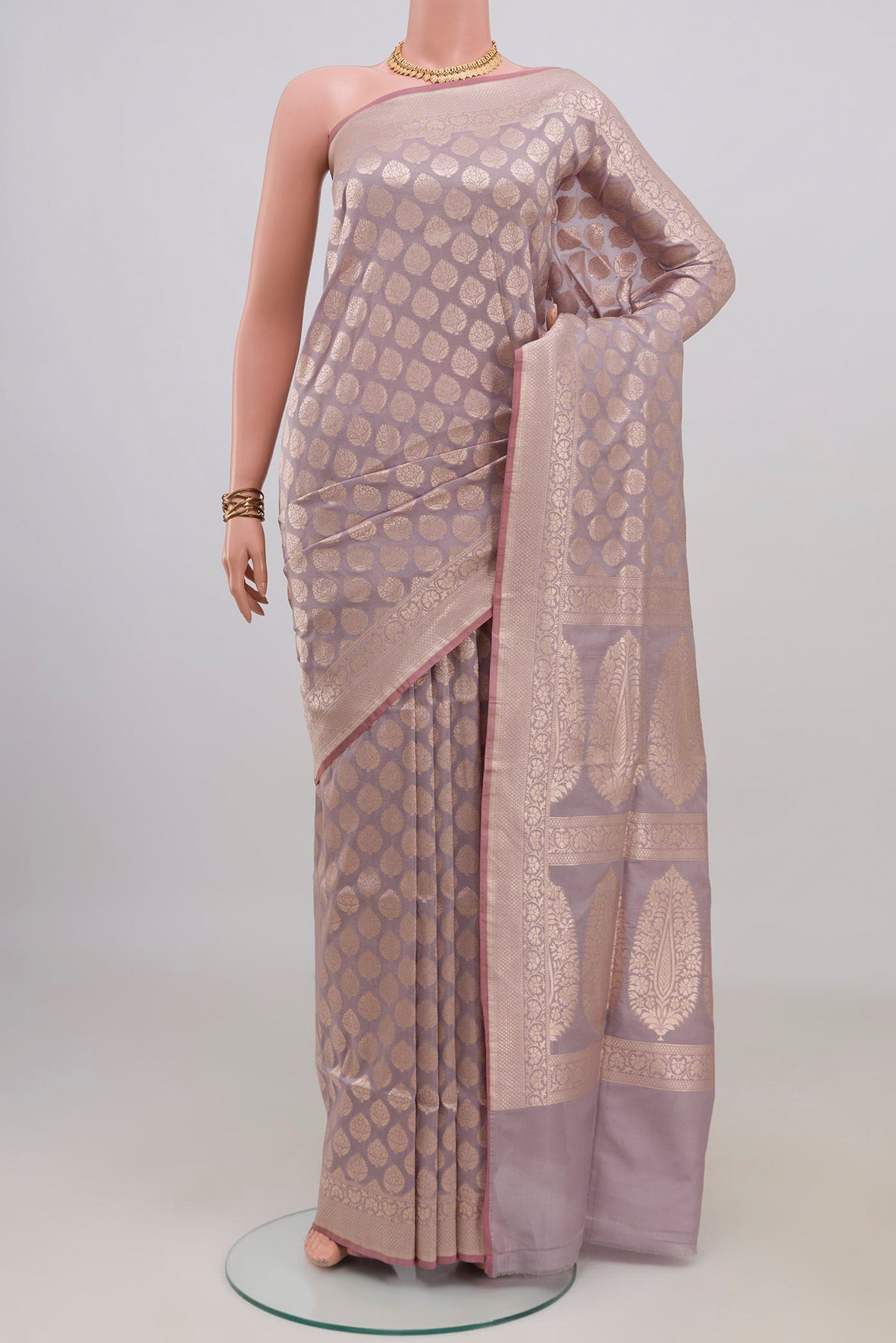 Pure Silk Lavender Banarasi Saree with Zari Brocade on the body and Zari Border.  displayed on a mannequin