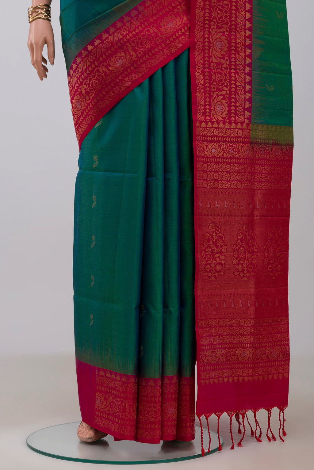 Pleats and pallu of Peacock Blue Soft Silk Saree with Zari Butta on the body and Fancy Border. 