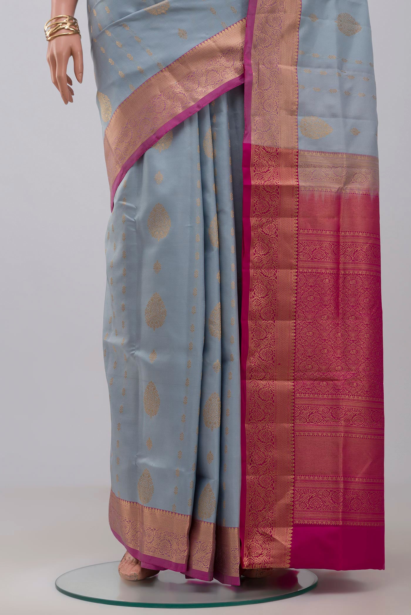 Pleats and pallu of Light Blue Soft Silk Saree with Zari Butta on the body and Zari Border. 