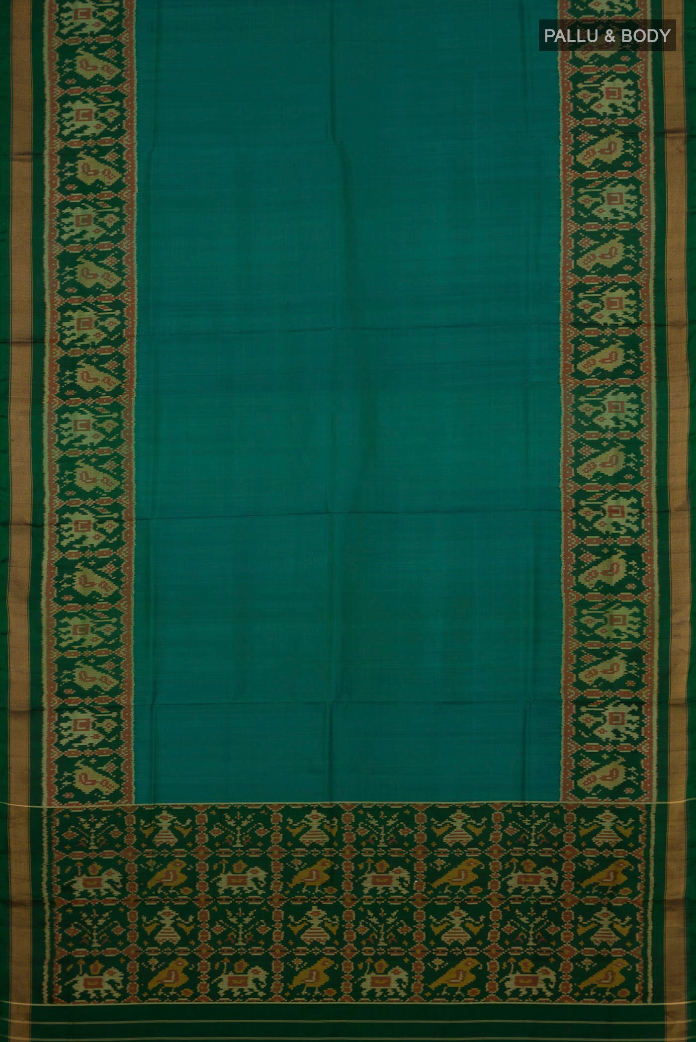 Flat view of Teal Rajkot Patola Silk Saree with Plain Body and Ikat Border. 