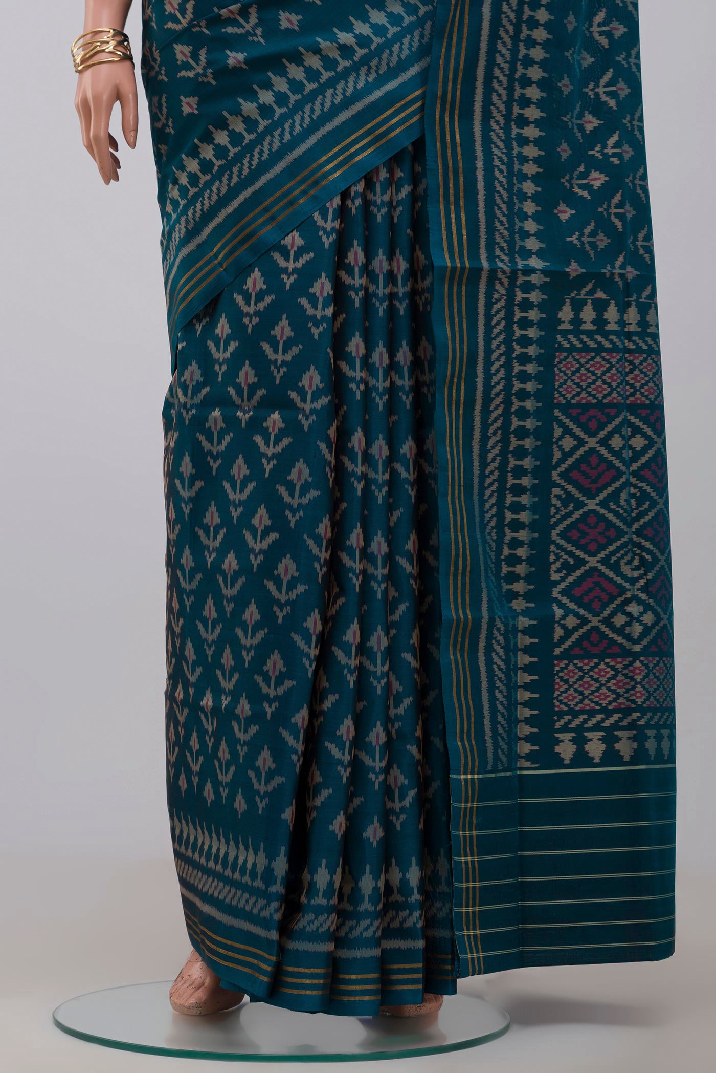 Pleats and pallu of Blue Rajkot Patola Silk Saree with Ikat design on the body and Thin Zari Line. 