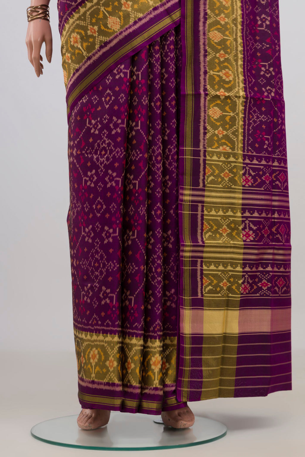 Pleats and pallu of Pure Silk Purple Rajkot Patola Saree with Ikat design on the body and Ikat Border. 