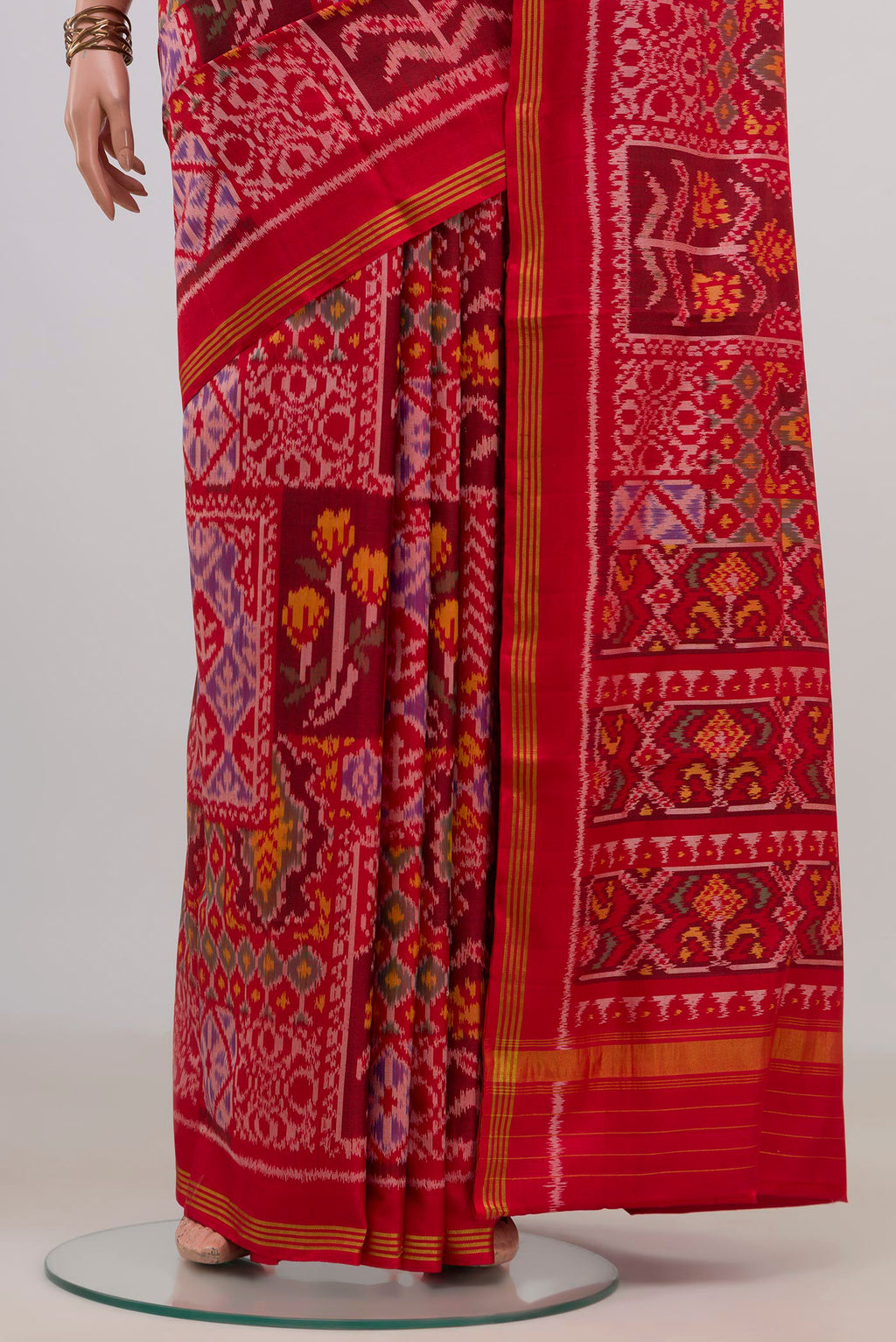 Pleats and pallu of Pure Silk Red Rajkot Patola Saree with Pure Ikat on the body and Thin Zari Line. 