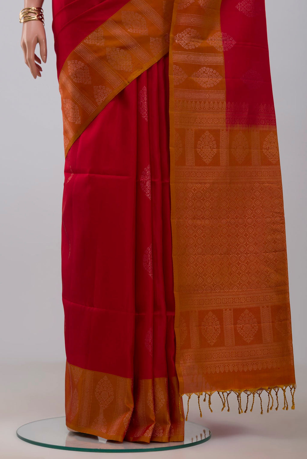Pleats and pallu of Red Soft Silk Saree with Zari Butta on the body and Fancy Border. 