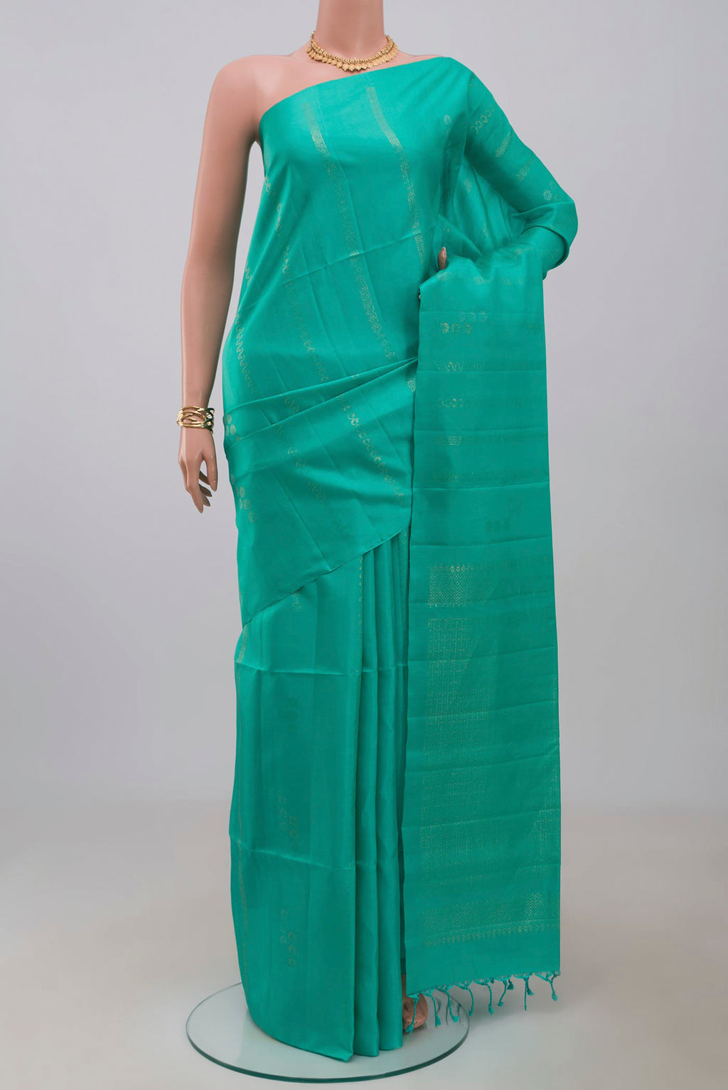 Blue Soft Silk Saree with Fancy on the body and Without Border.  displayed on a mannequin