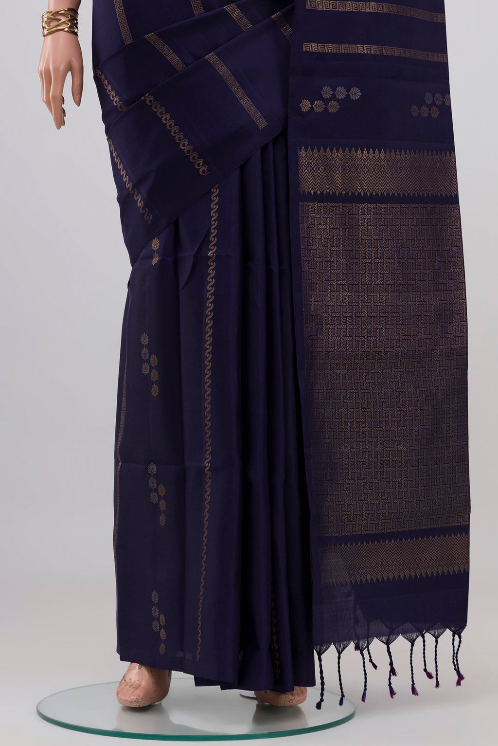 Pleats and pallu of Navy Blue Soft Silk Saree with Stripes on the body and Without Border. 