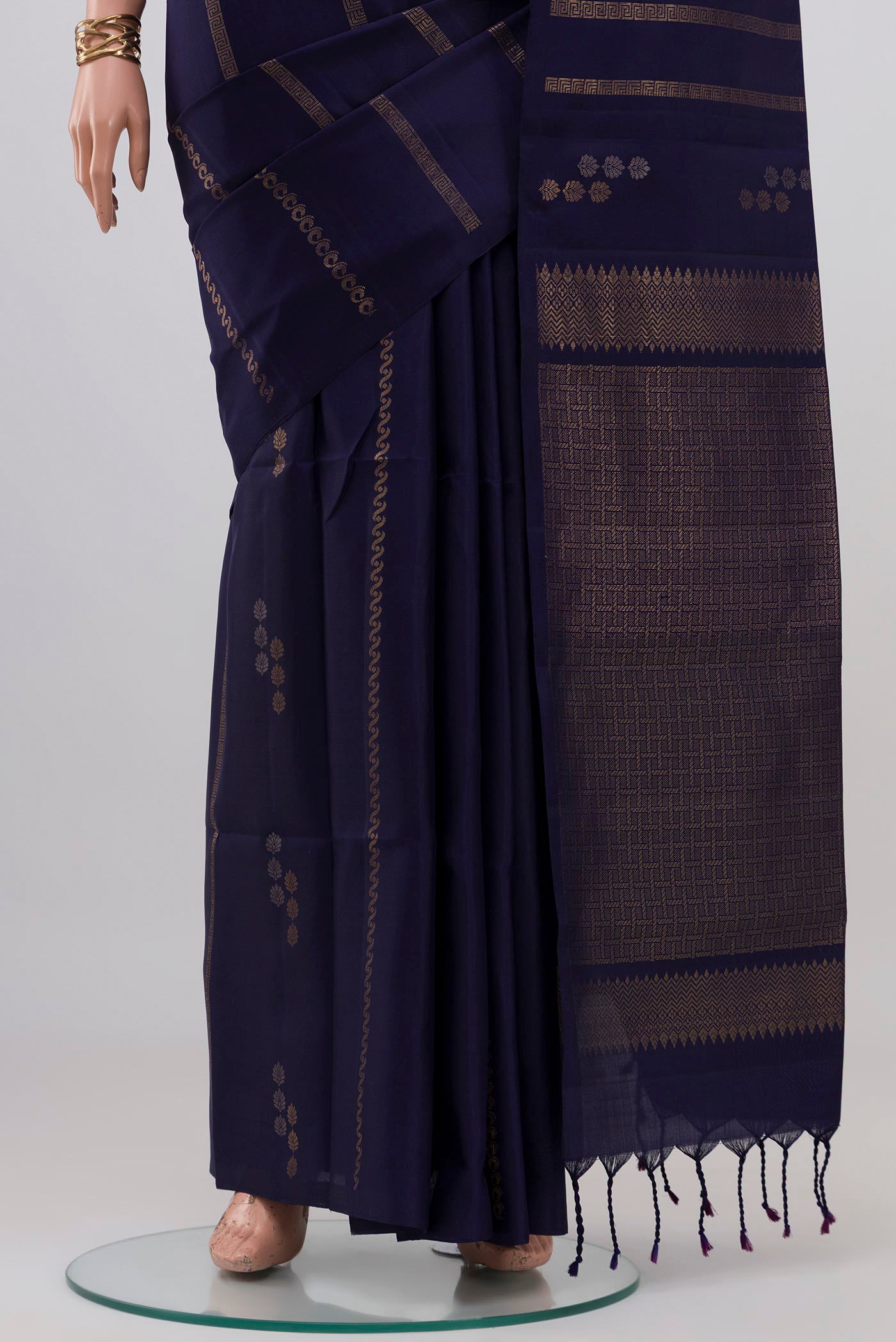 Pleats and pallu of Navy Blue Soft Silk Saree with Stripes on the body and Without Border. 