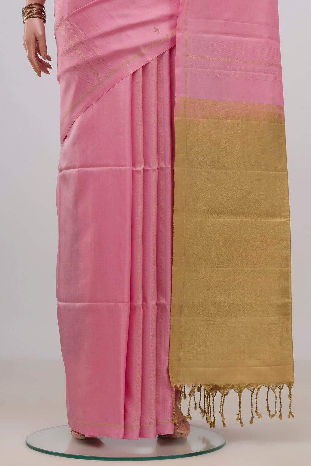 Pleats and pallu of Pure Silk Pink Soft Saree with Fancy on the body and Thin Zari Line. 