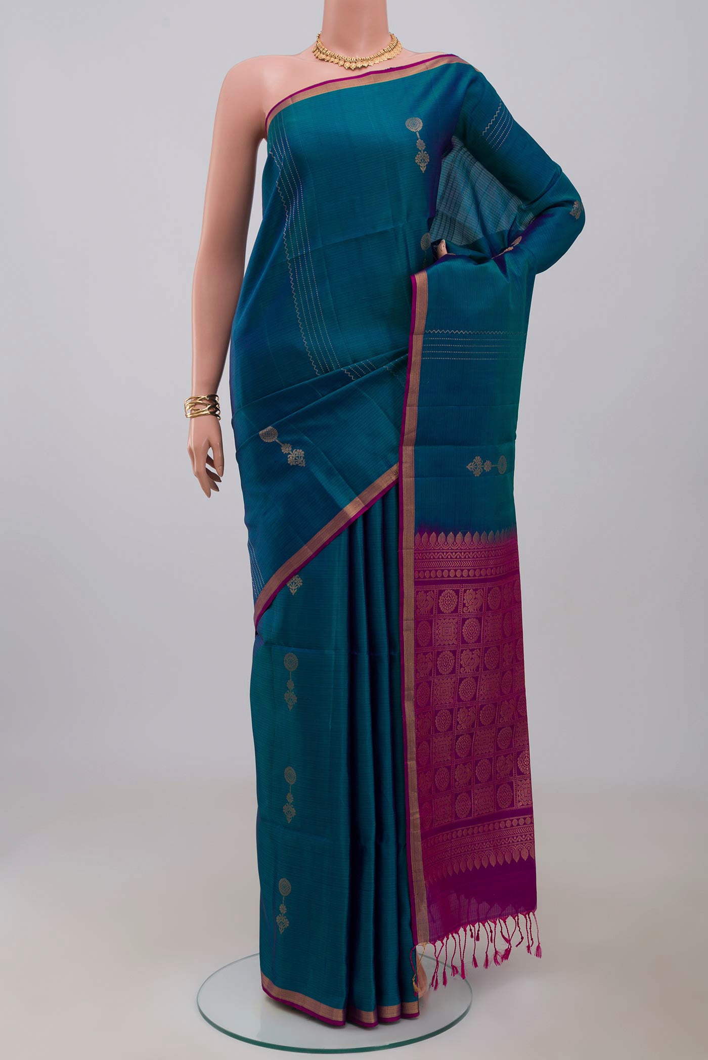 Blue Soft Silk Saree with Fancy on the body and Thin Zari Line.  displayed on a mannequin