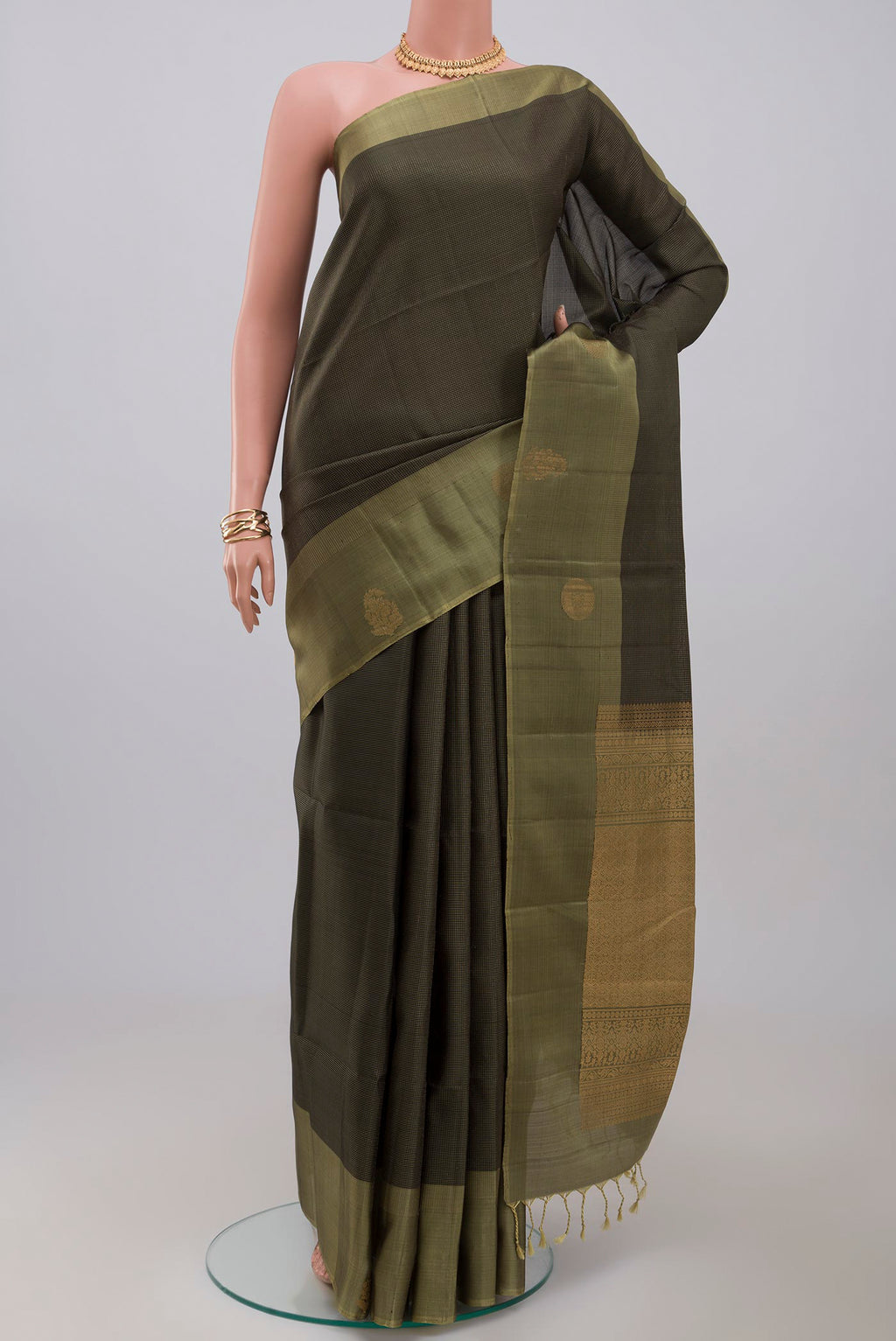 Black Soft Silk Saree with Checked design on the body and Fancy Border.  displayed on a mannequin