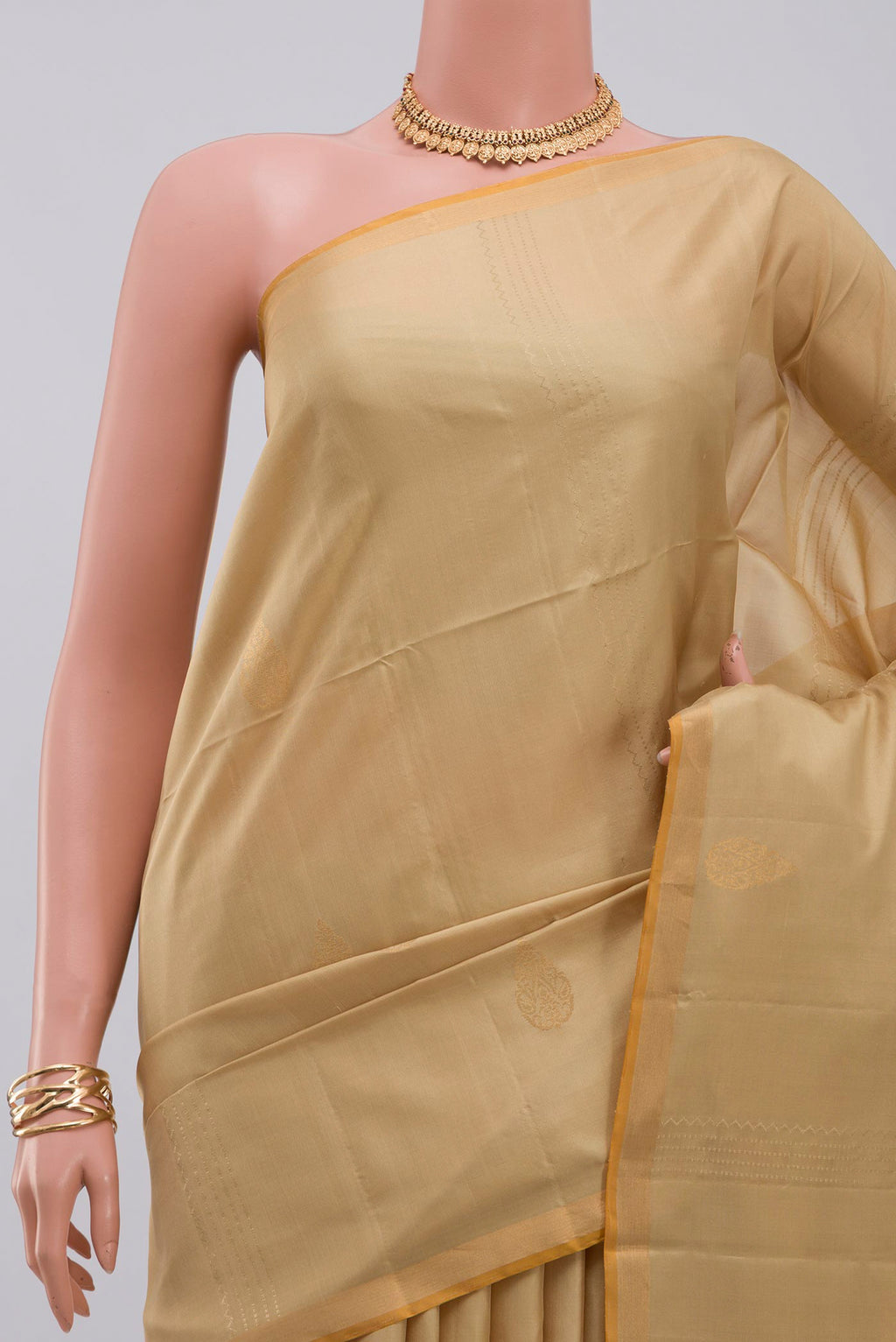 Border image of Cream Soft Silk Saree with Fancy on the body and Thin Zari Line. 