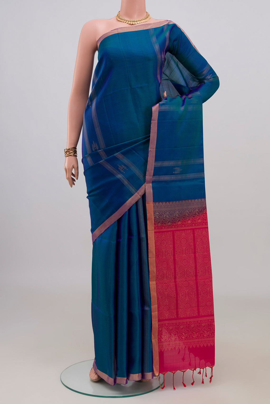 Pure Silk Blue Soft Saree with Stripes on the body and Thin Zari Line.  displayed on a mannequin