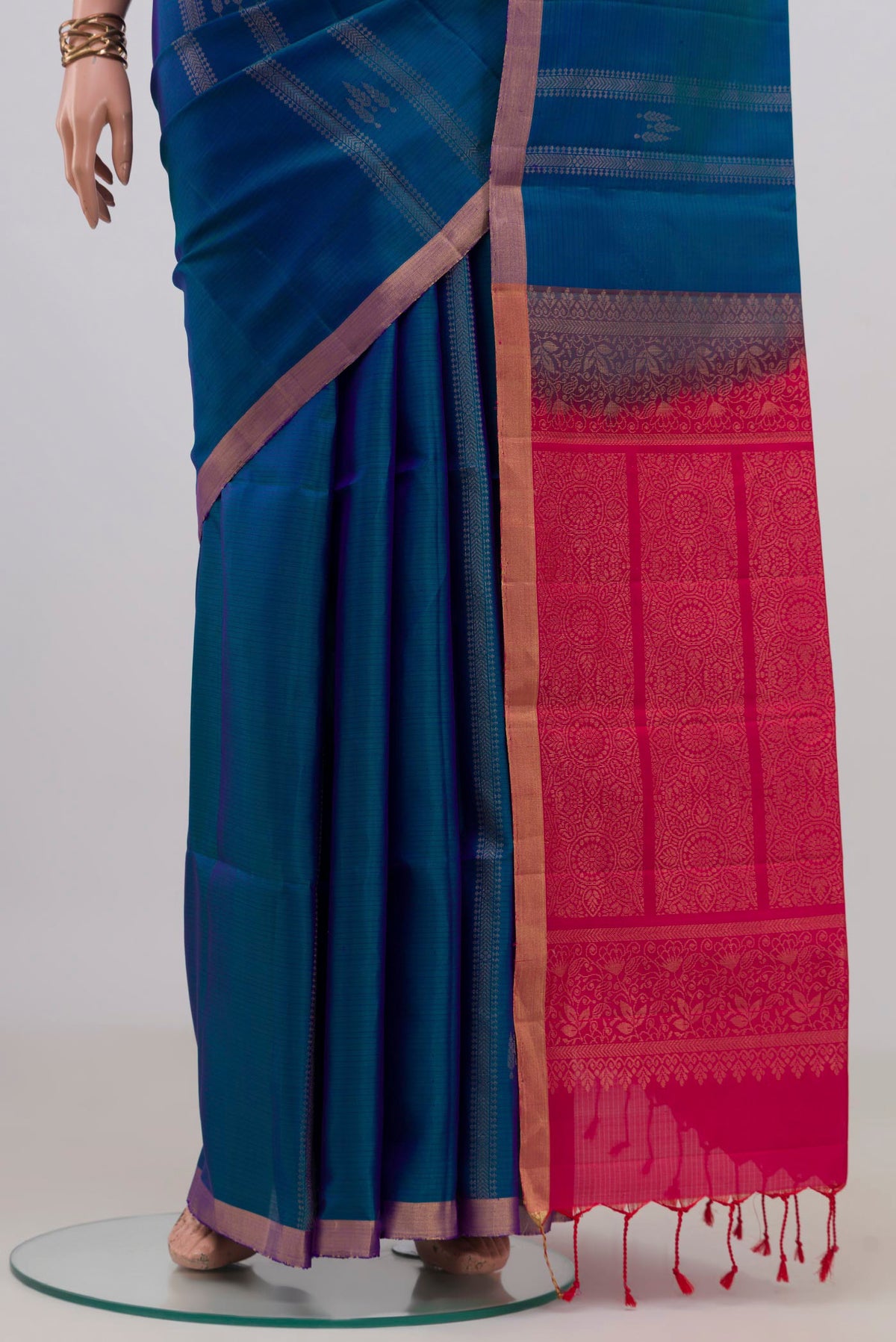Pleats and pallu of Pure Silk Blue Soft Saree with Stripes on the body and Thin Zari Line. 