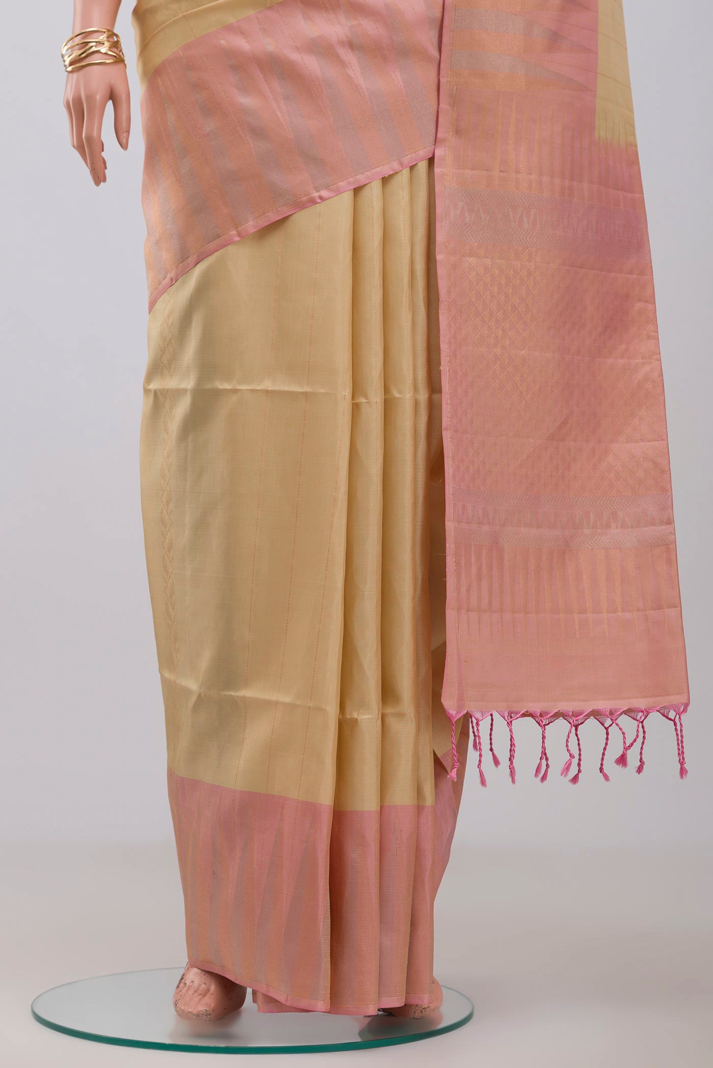 Pleats and pallu of Cream Soft Silk Saree with Fancy on the body and Fancy Border. 