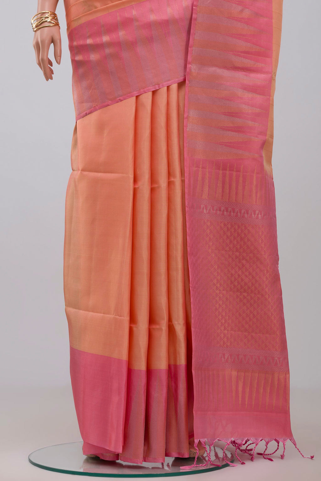 Pleats and pallu of Peach Soft Silk Saree with Fancy on the body and Fancy Border. 