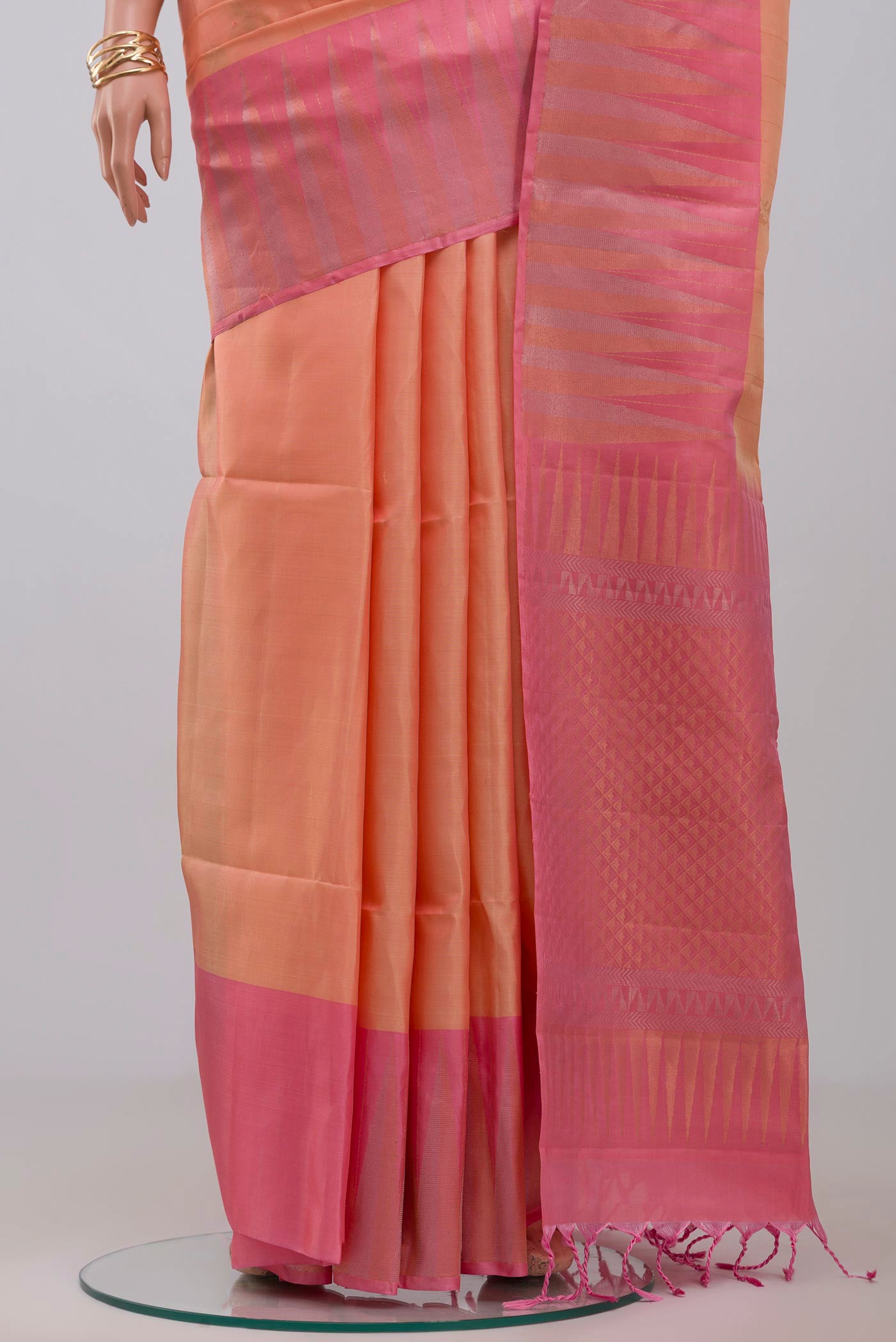 Pleats and pallu of Peach Soft Silk Saree with Fancy on the body and Fancy Border. 