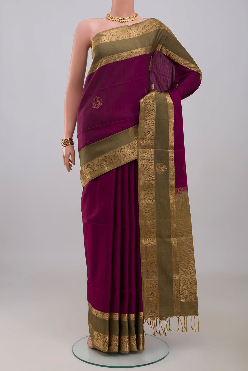 Purple Soft Silk Saree with Zari Butta on the body and Zari Border.  displayed on a mannequin