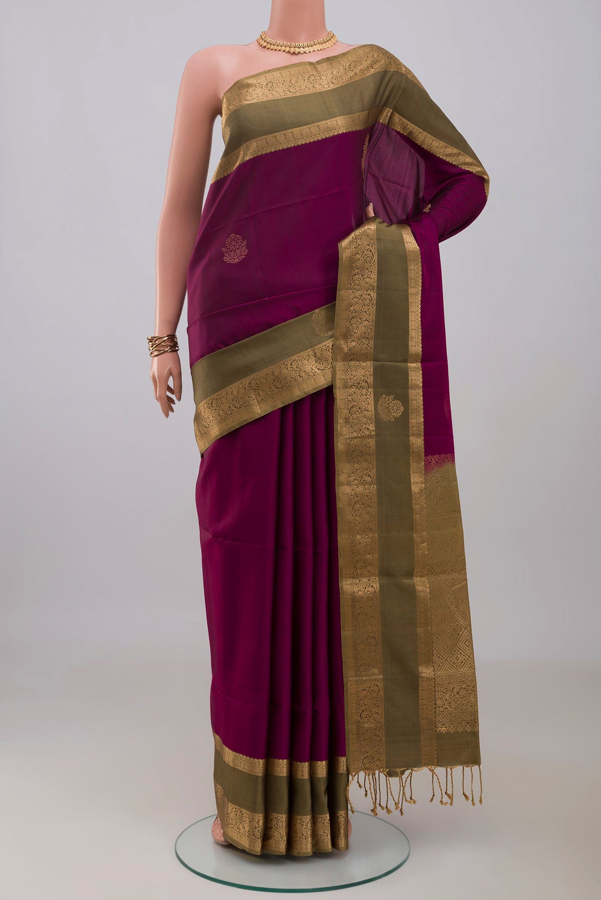 Purple Soft Silk Saree with Zari Butta on the body and Zari Border.  displayed on a mannequin