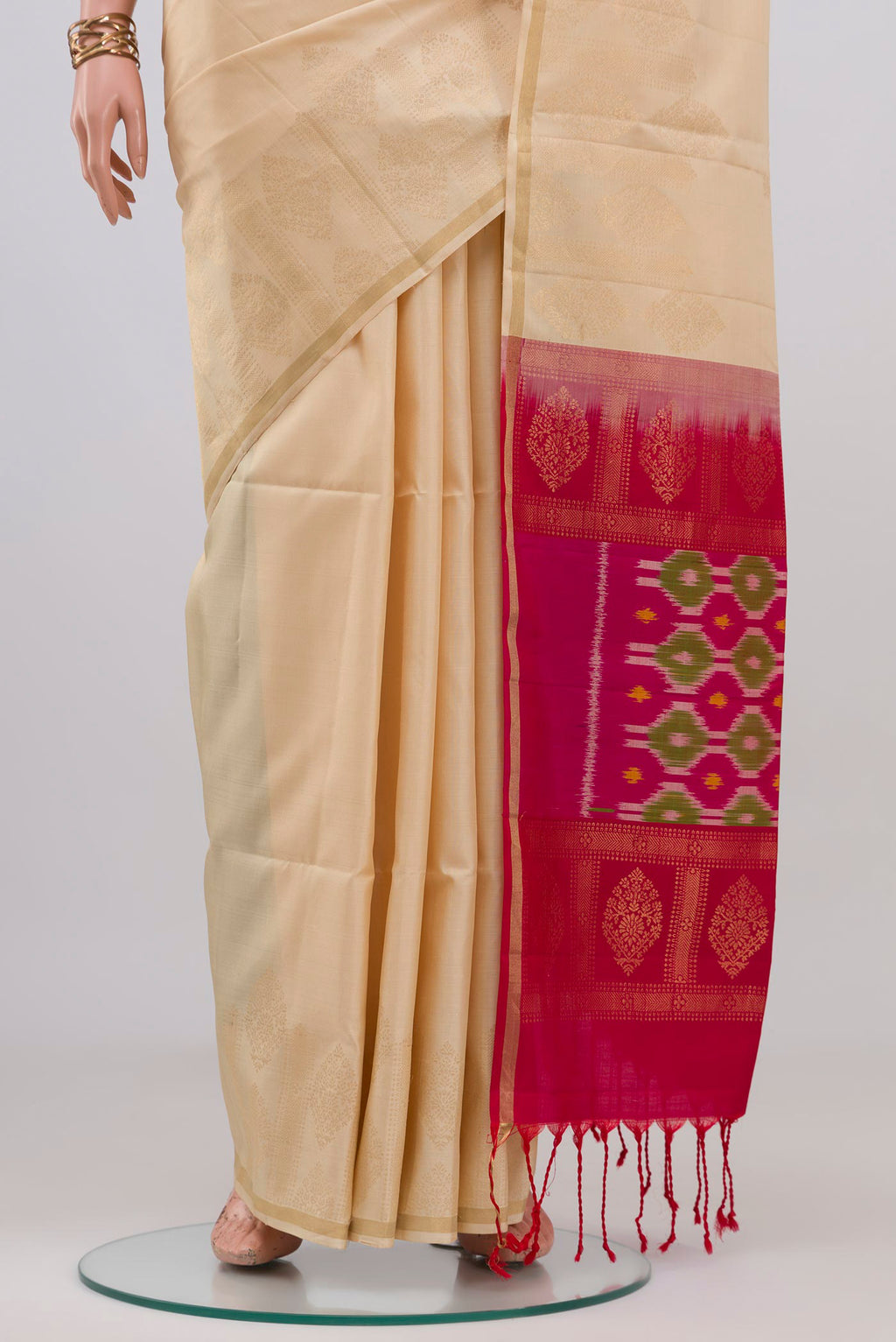 Pleats and pallu of Cream Soft Silk Saree with Zari Butta on the body and Fancy Border. 