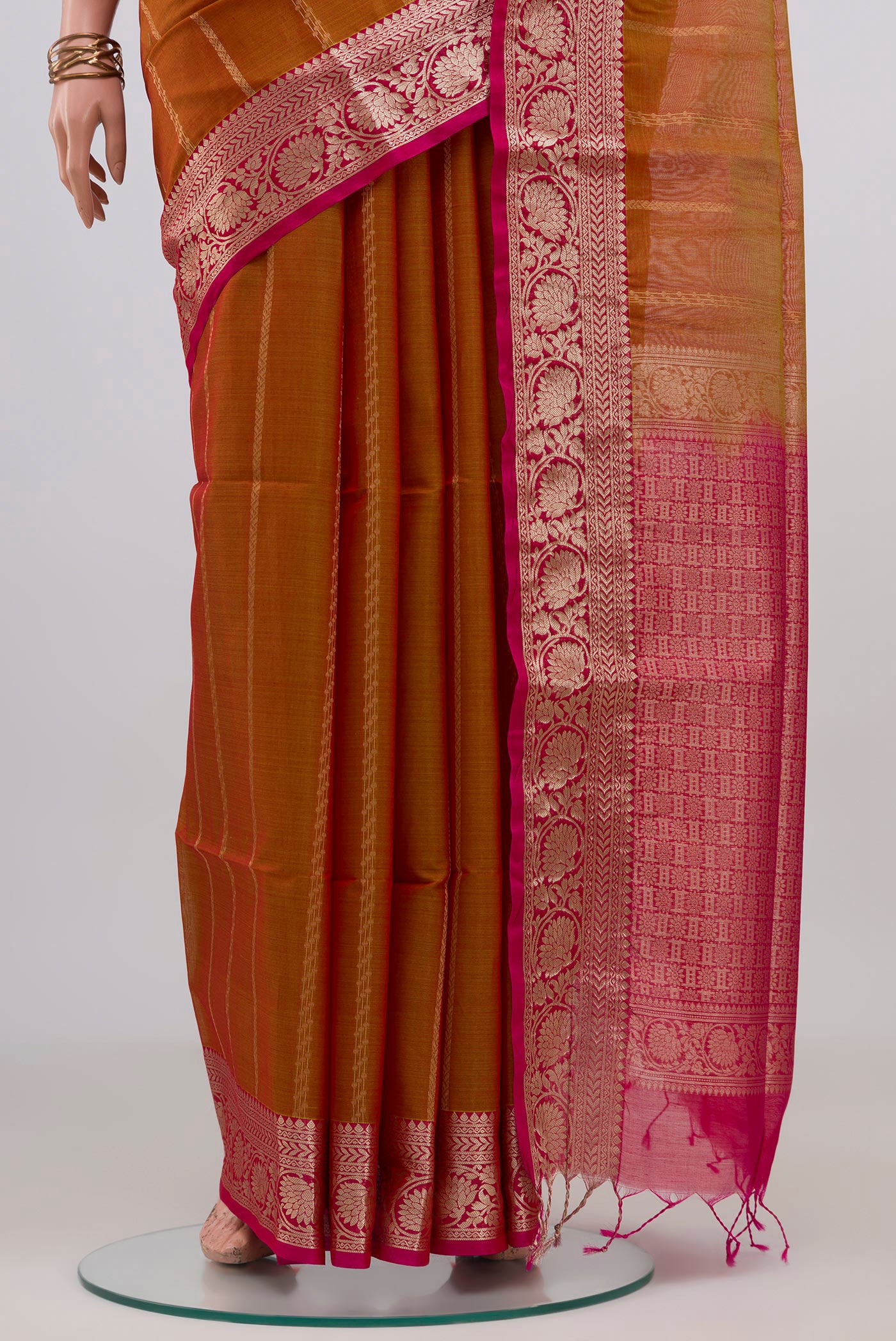 Pleats and pallu of Mustard Dual Tone Silk Cotton Saree with Stripes on the body and Zari Border. 
