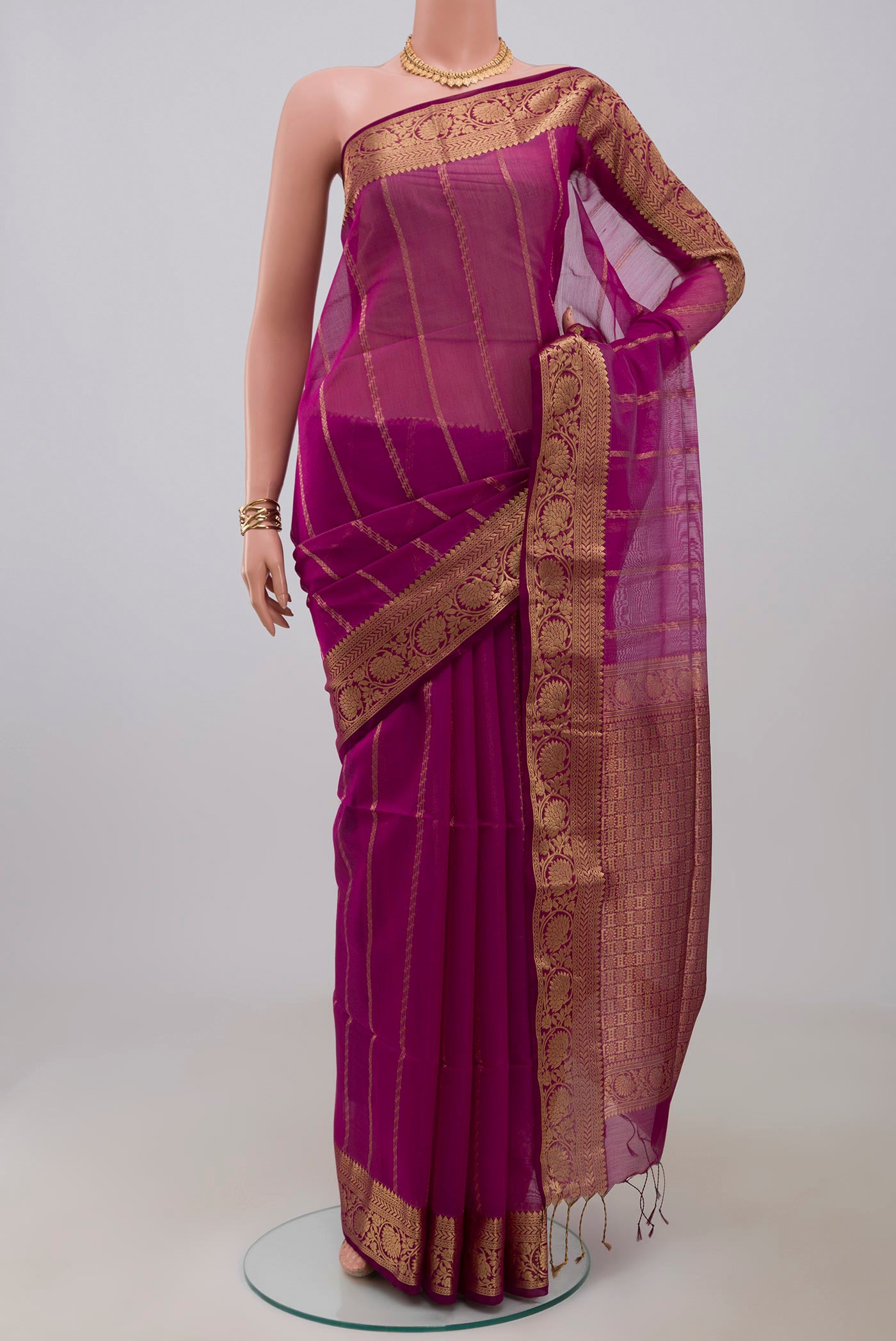 Purple Silk Cotton Saree with Stripes on the body and Zari Border.  displayed on a mannequin
