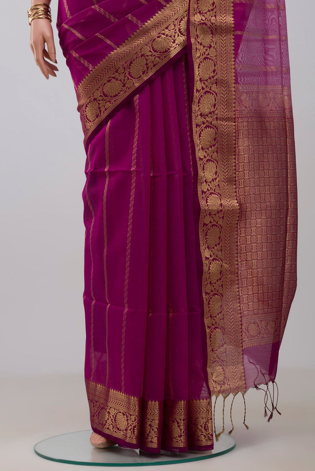 Pleats and pallu of Purple Silk Cotton Saree with Stripes on the body and Zari Border. 