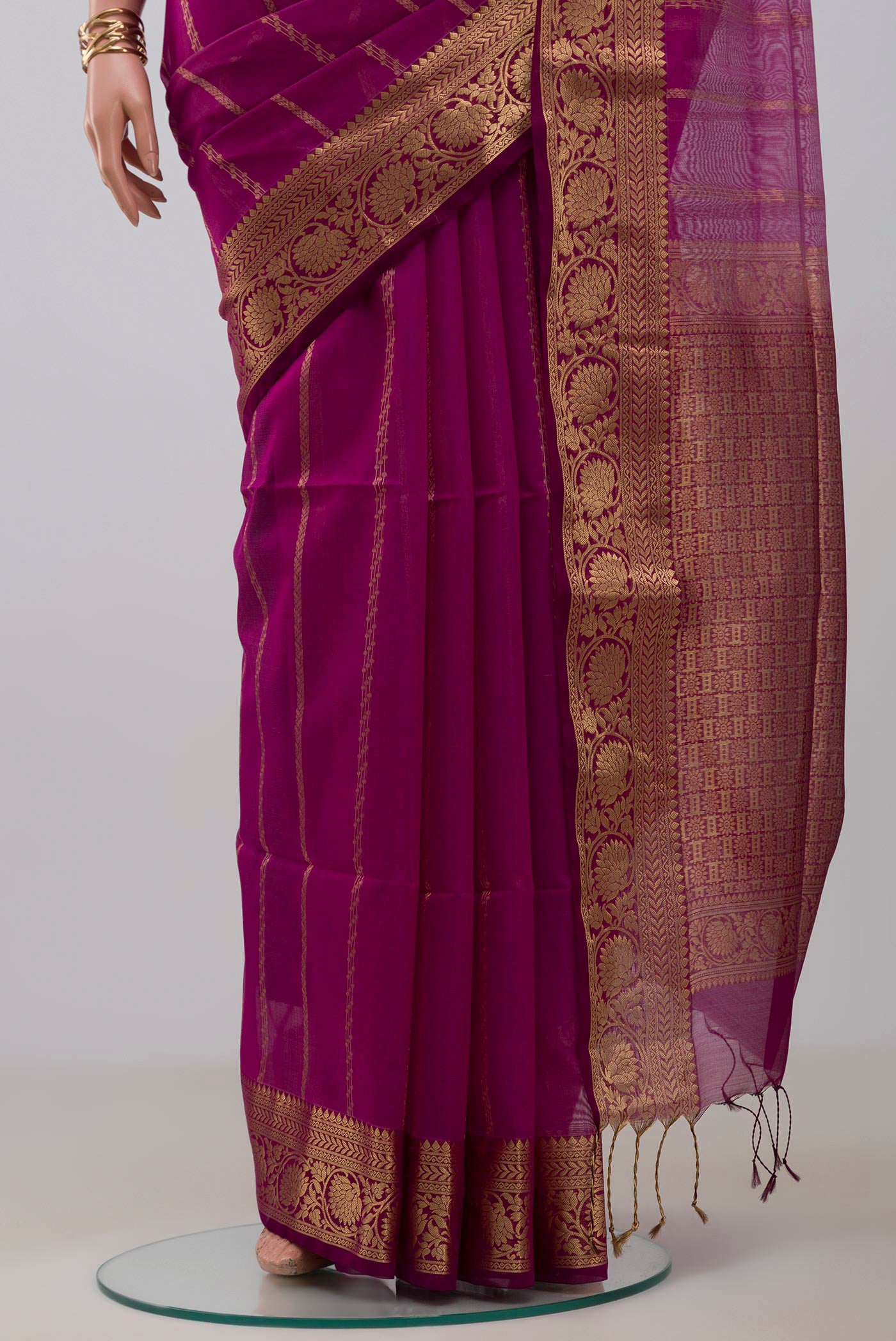 Pleats and pallu of Purple Silk Cotton Saree with Stripes on the body and Zari Border. 