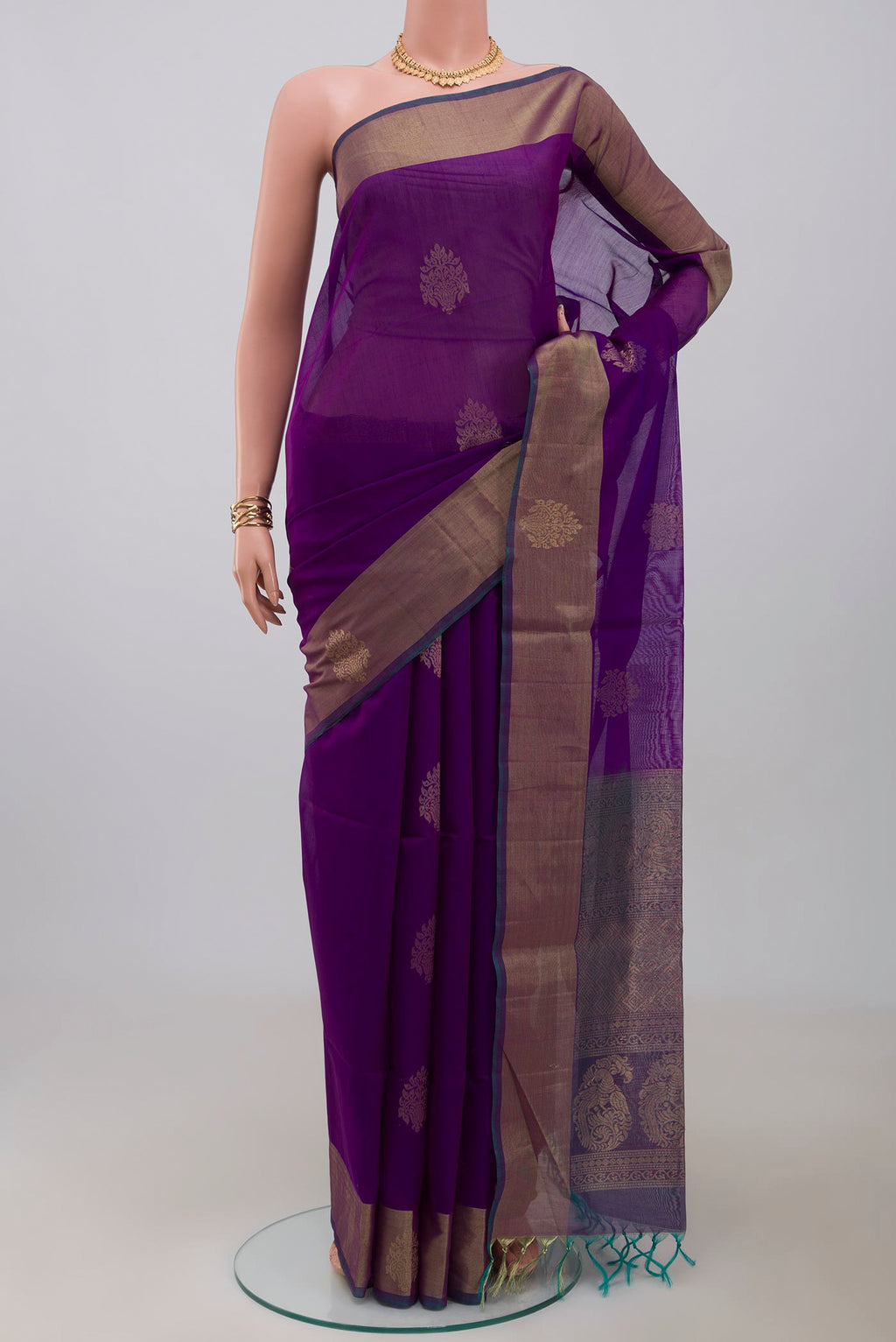 Purple Silk Cotton Saree with Zari Butta on the body and Zari Border.  displayed on a mannequin
