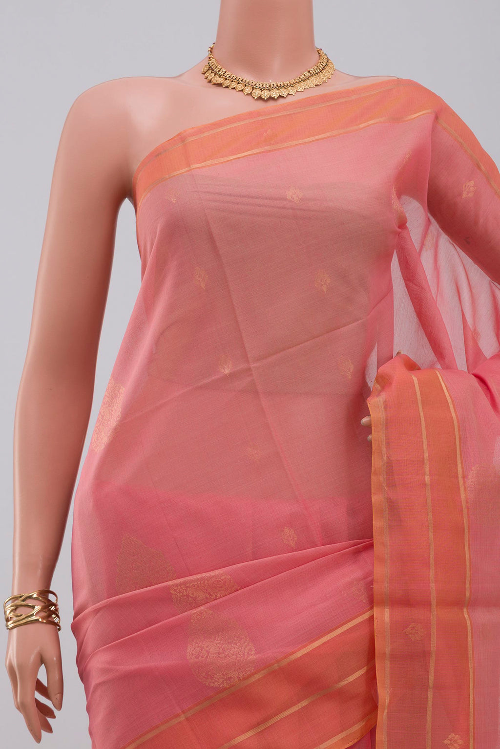 Border image of Pink Silk Cotton Saree with Zari Butta on the body and Thin Zari Line. 