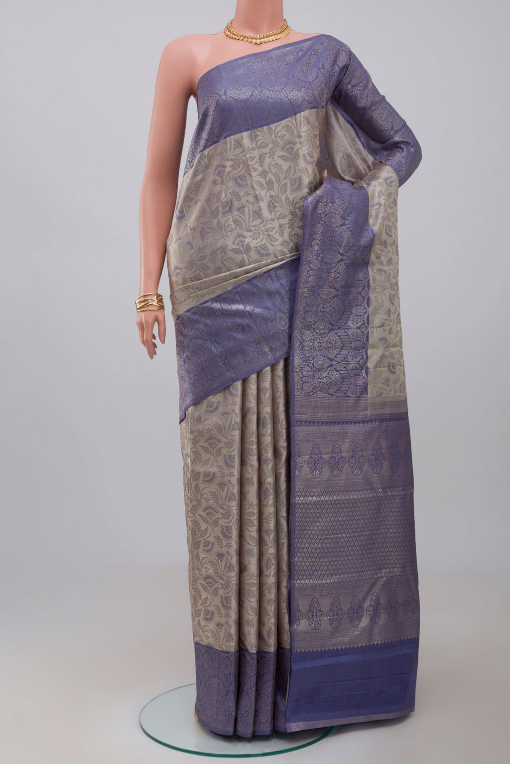 Grey Kanchipuram Saree with Zari Brocade on the body and Fancy Border.  displayed on a mannequin