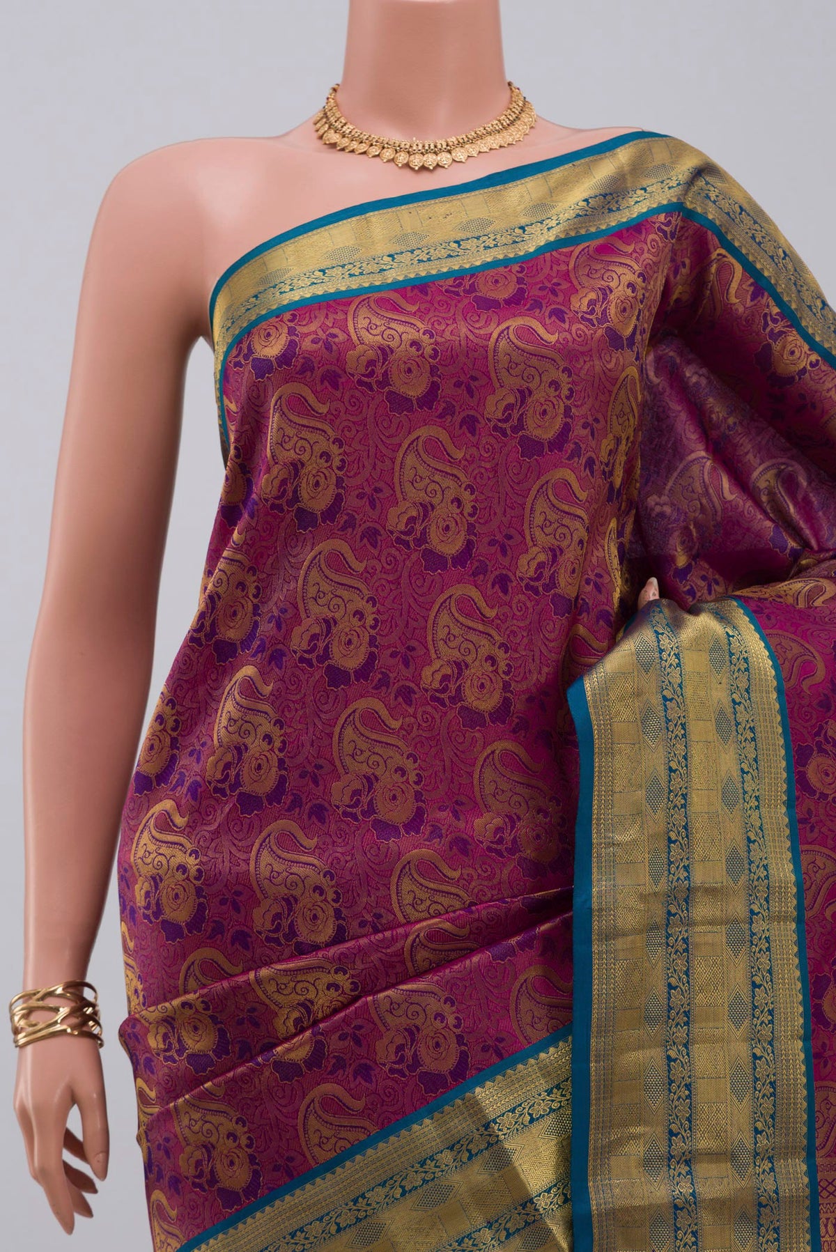 Border image of Purple Kanchipuram Saree with Zari Brocade on the body and Zari Border. 